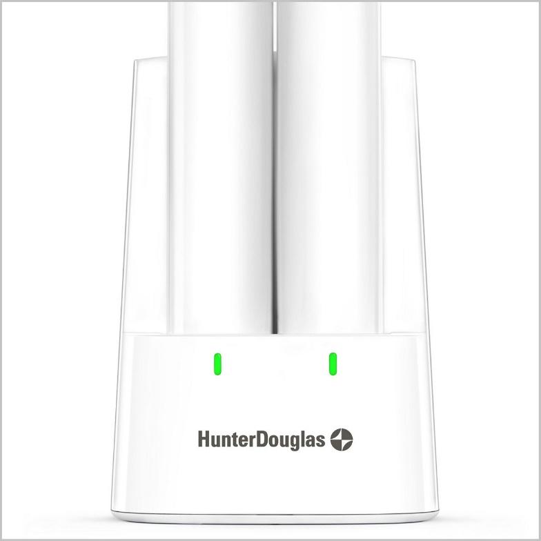 A white and green light is on in front of the hunter douglas logo.