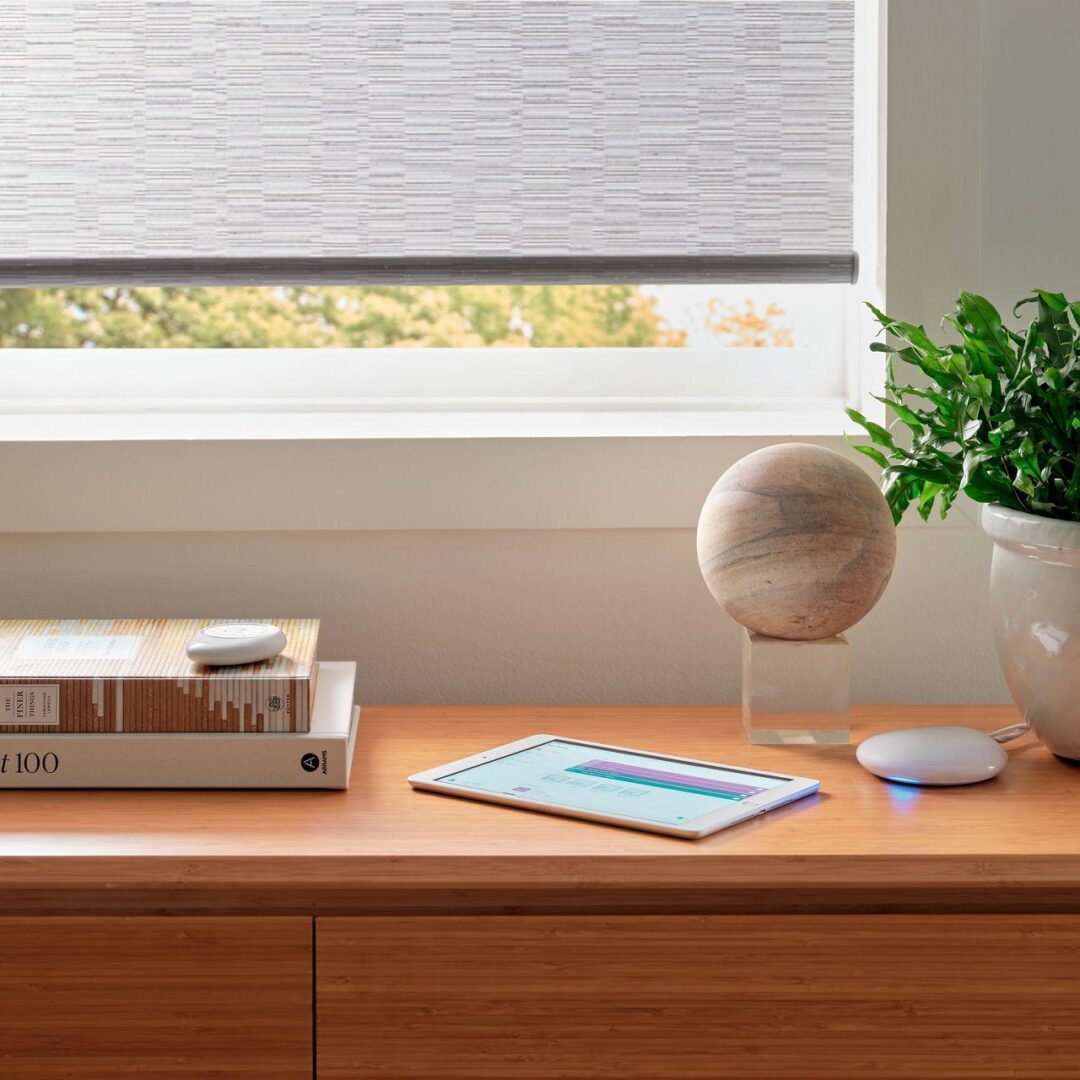 A table with some books and a lamp on it
