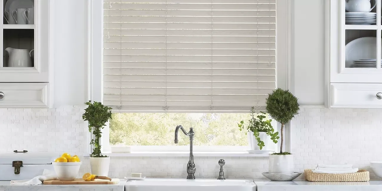 A sink and window with blinds closed