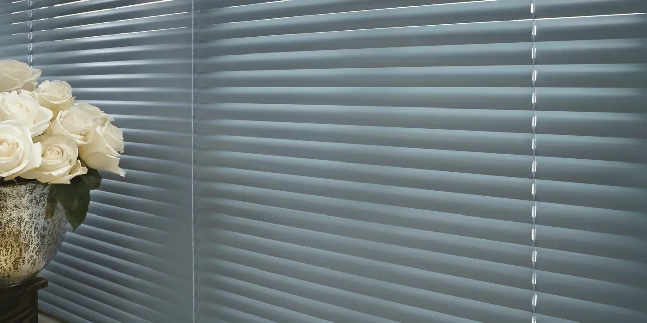 A close up of the window blinds on a wall